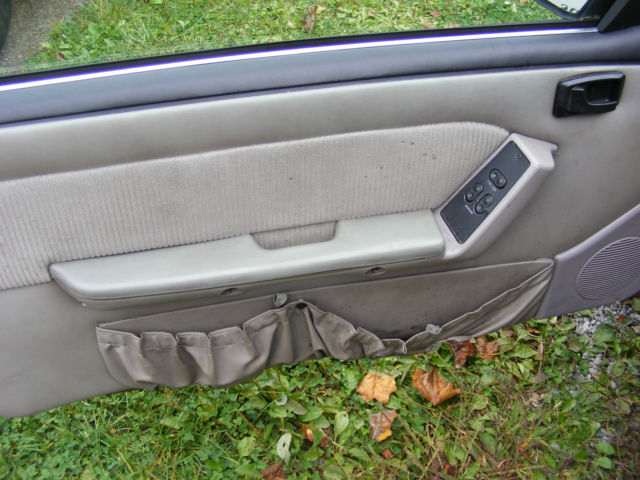 1990 Burgundy Ford Mustang Hatchback