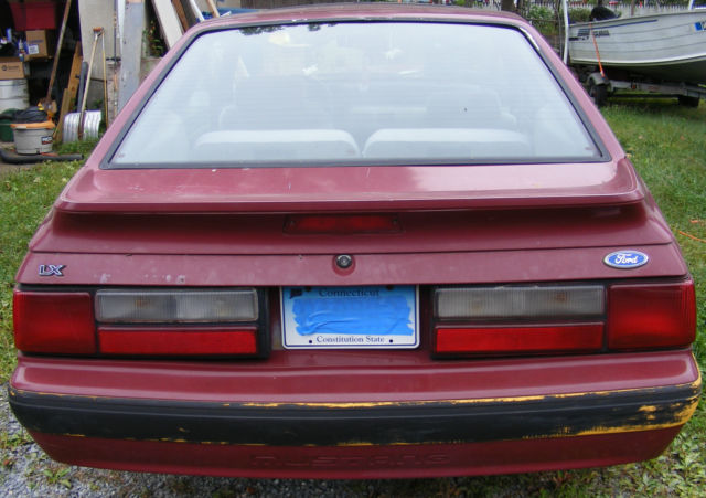 1990 Burgundy Ford Mustang Hatchback