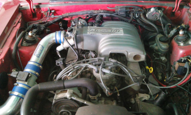 1990 Strawberry Ford Mustang 2 Door Hatchback