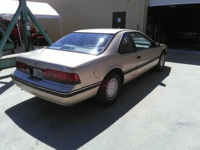 1990 Gold Ford Thunderbird Coupe