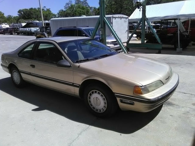 1990 Gold Ford Thunderbird Coupe