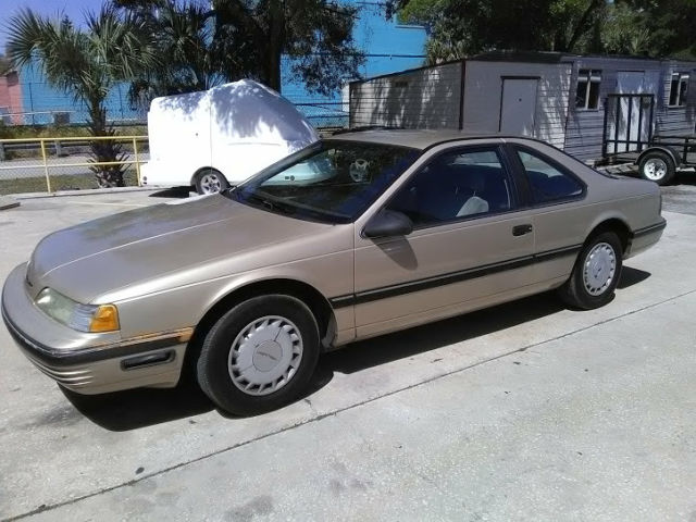 1990 Gold Ford Thunderbird Coupe