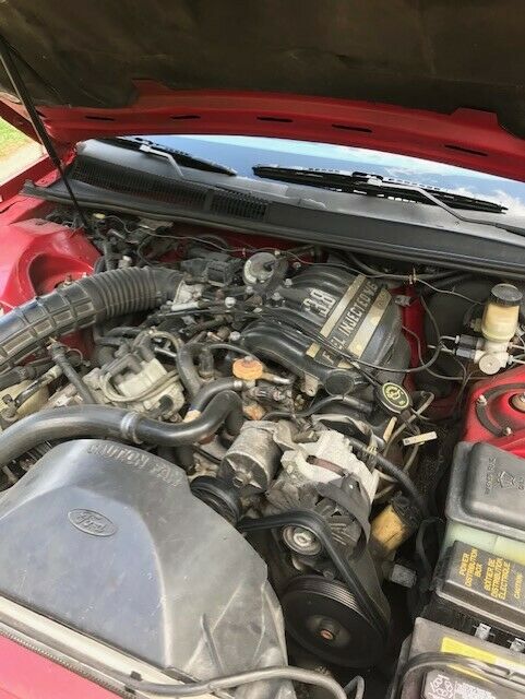 1990 Red Ford Thunderbird Coupe