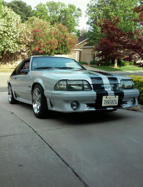 1990 gray Ford Mustang Hatchback