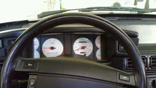 1990 gray Ford Mustang Hatchback