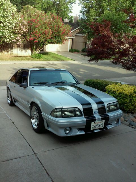 1990 gray Ford Mustang Hatchback