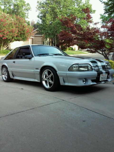 1990 gray Ford Mustang Hatchback