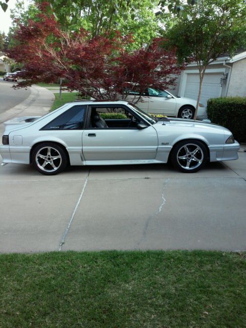 1990 gray Ford Mustang Hatchback