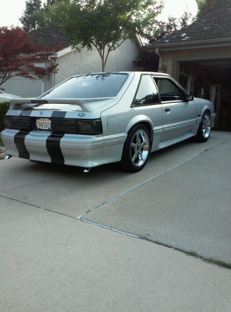 1990 gray Ford Mustang Hatchback