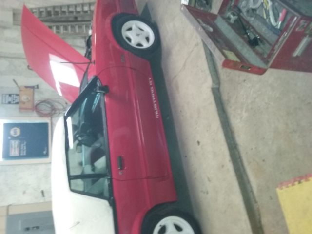 1990 Red Ford Mustang Convertible