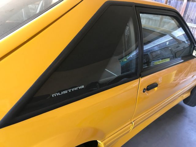 1990 Yellow Ford Mustang Hatchback