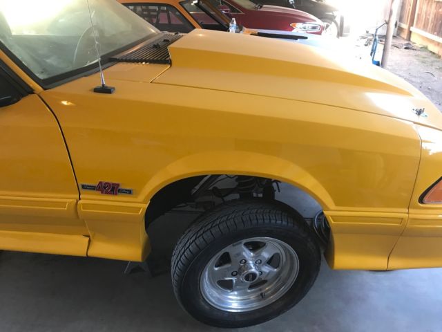 1990 Yellow Ford Mustang Hatchback