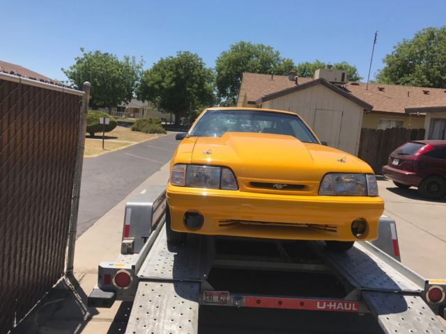 1990 Yellow Ford Mustang Hatchback