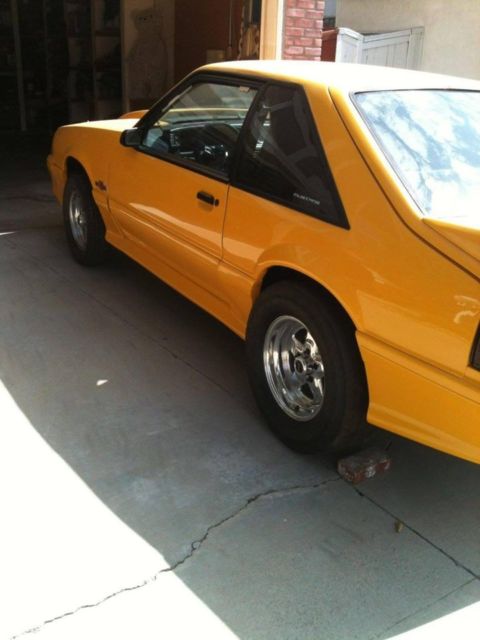 1990 Yellow Ford Mustang Hatchback