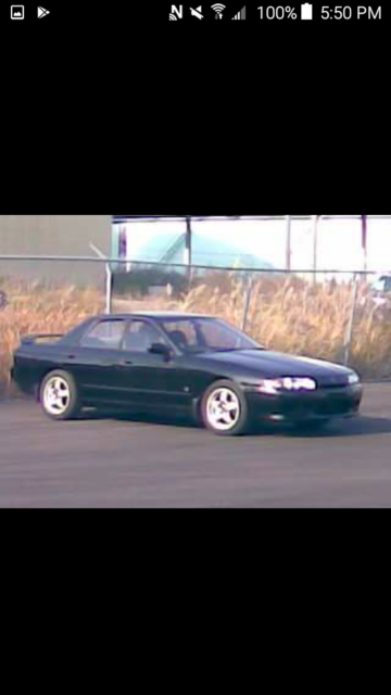 1990 Black-Gray Nissan GT-R 4-DOORS