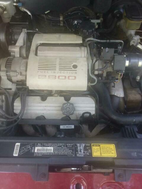 1990 Red Oldsmobile Ninety-Eight 4 door