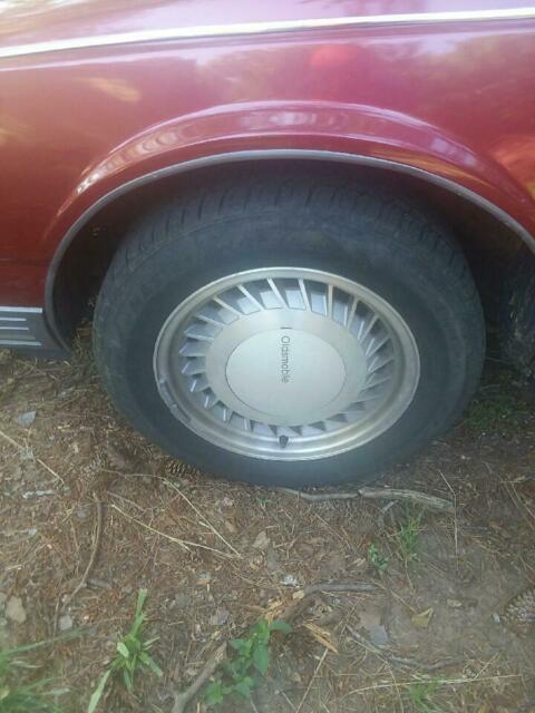 1990 Red Oldsmobile Ninety-Eight 4 door