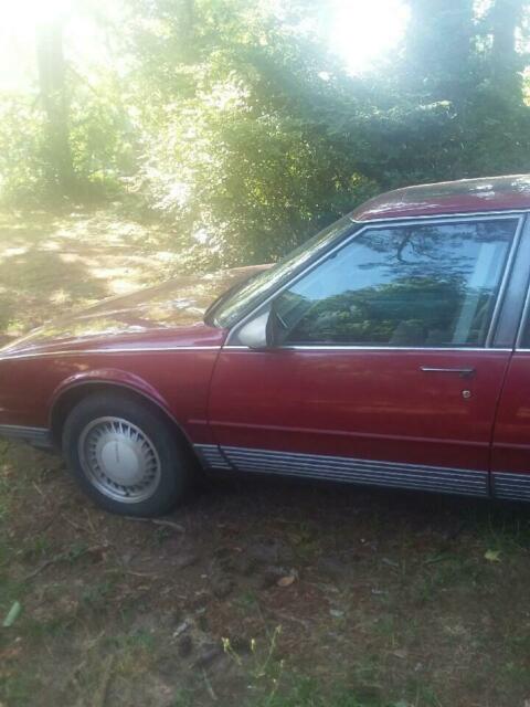 1990 Red Oldsmobile Ninety-Eight 4 door