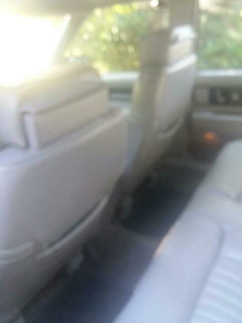 1990 Red Oldsmobile Ninety-Eight 4 door