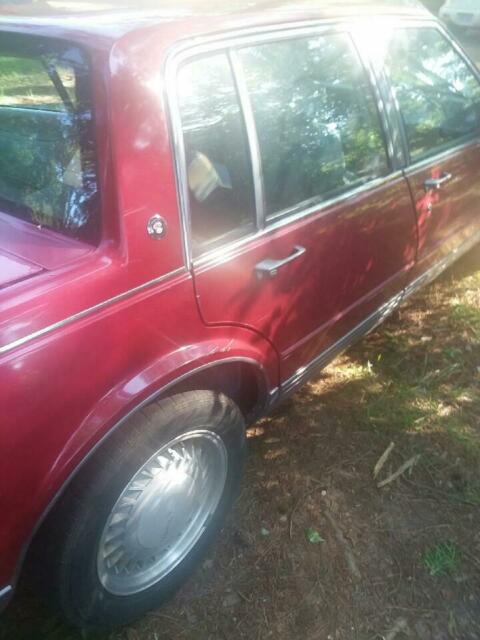 1990 Red Oldsmobile Ninety-Eight 4 door