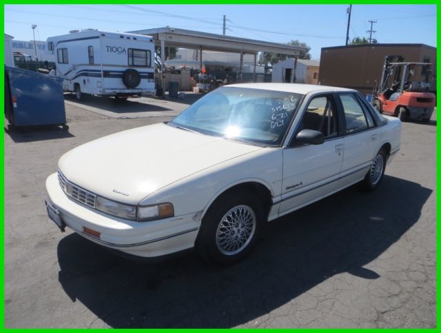 1990 Tan Oldsmobile Cutlass Sedan