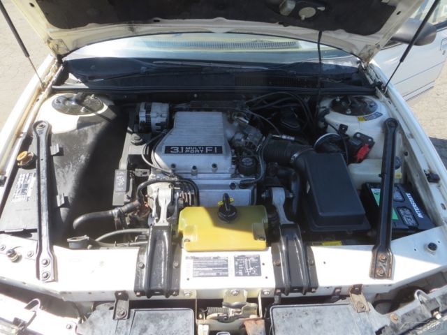 1990 Tan Oldsmobile Cutlass Sedan