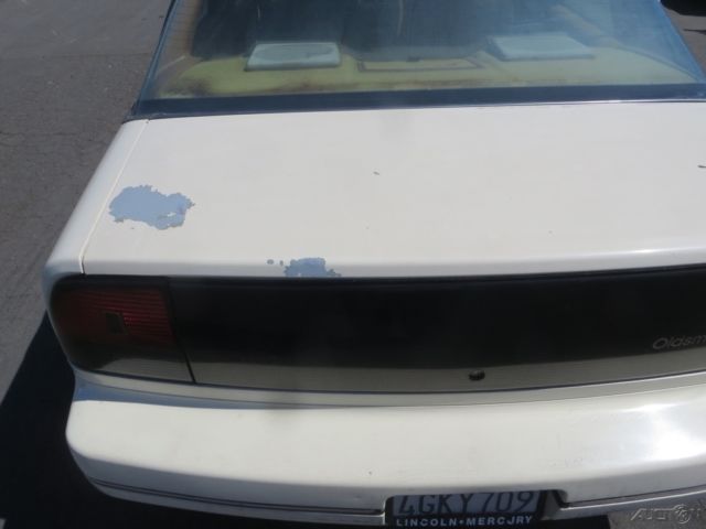 1990 Tan Oldsmobile Cutlass Sedan