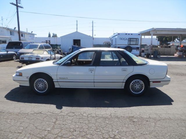 1990 Tan Oldsmobile Cutlass Sedan