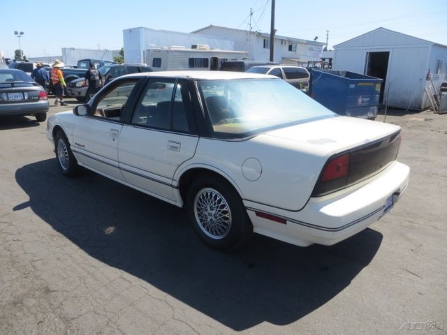1990 Tan Oldsmobile Cutlass Sedan