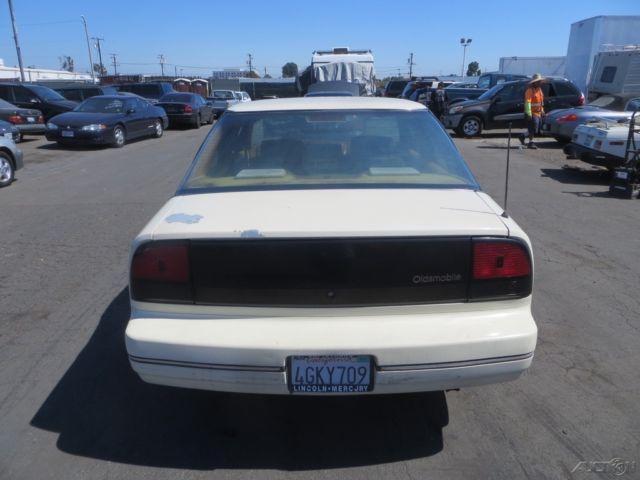 1990 Tan Oldsmobile Cutlass Sedan