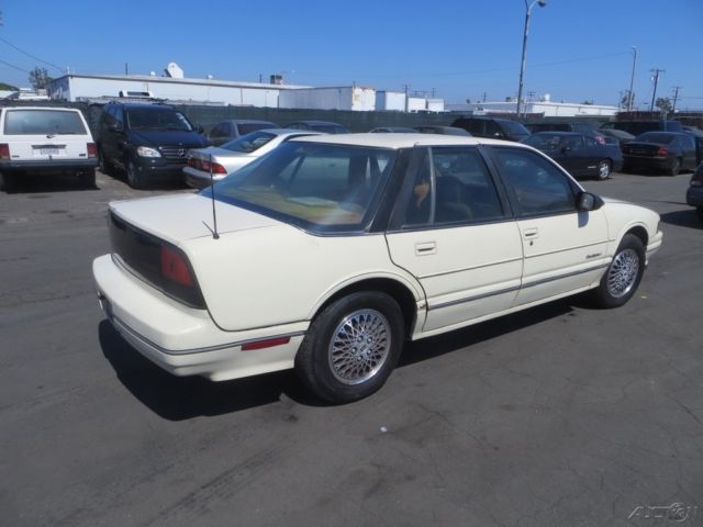 1990 Tan Oldsmobile Cutlass Sedan