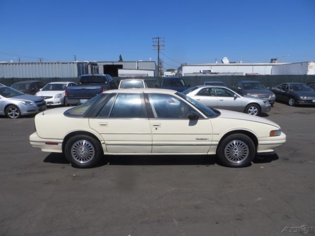 1990 Tan Oldsmobile Cutlass Sedan