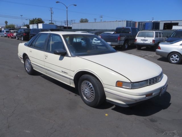 1990 Tan Oldsmobile Cutlass Sedan