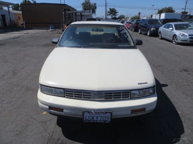 1990 Tan Oldsmobile Cutlass Sedan