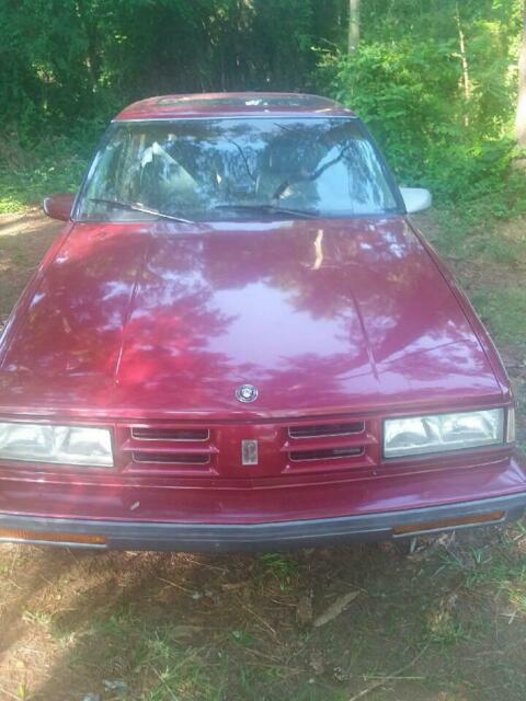1990 Red Oldsmobile Ninety-Eight 4 door