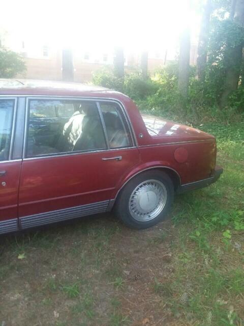 1990 Red Oldsmobile Ninety-Eight 4 door