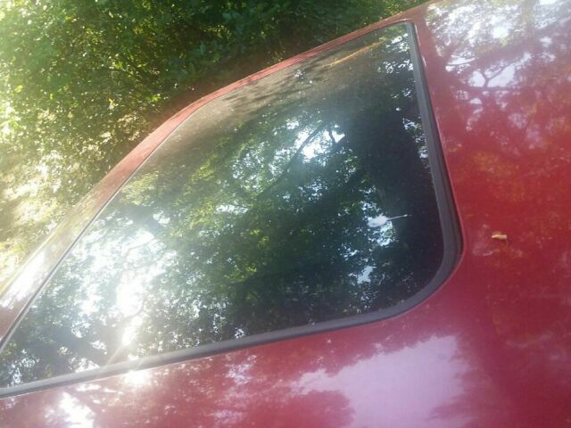 1990 Red Oldsmobile Ninety-Eight 4 door