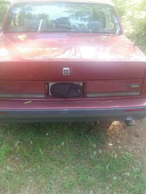 1990 Red Oldsmobile Ninety-Eight 4 door