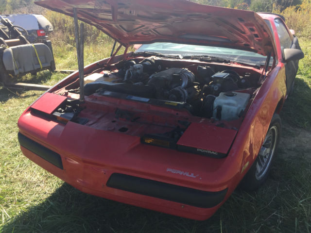 1990 Red Pontiac Firebird Hatchback