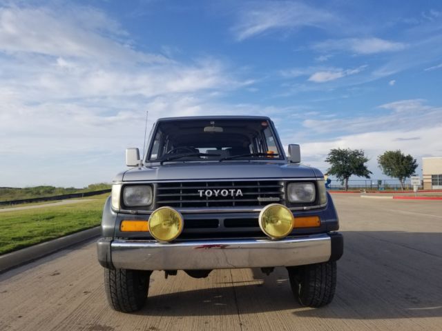 1990 Silver/Blue Toyota Land Cruiser SUV