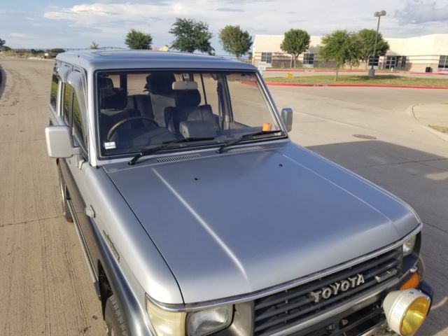 1990 Silver/Blue Toyota Land Cruiser SUV