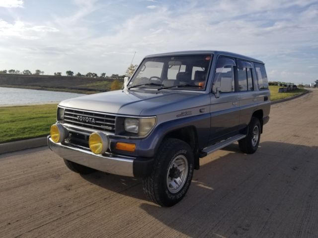 1990 Silver/Blue Toyota Land Cruiser SUV