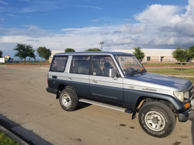 1990 Silver/Blue Toyota Land Cruiser SUV