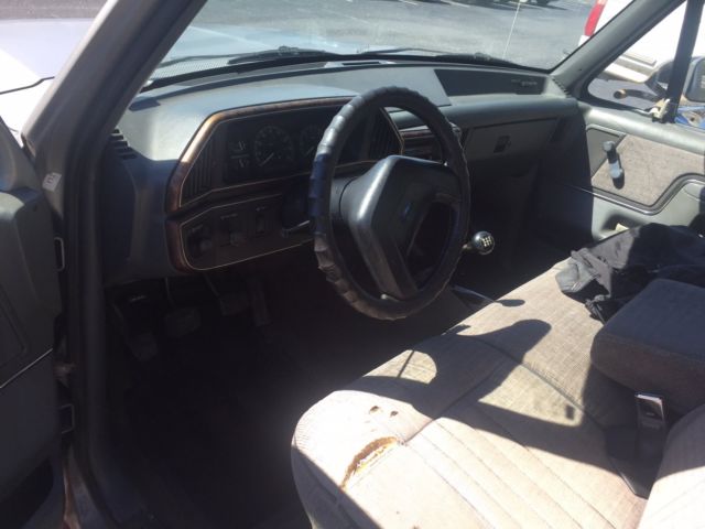 1991 silver Ford F-150 Standard Cab Pickup