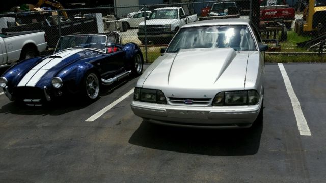 1991 grey Ford Mustang Hatchback