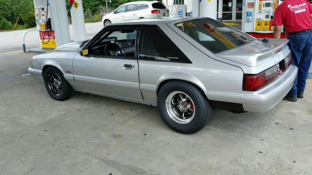 1991 grey Ford Mustang Hatchback