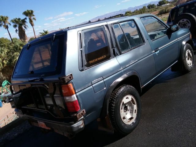 1991 blue/gray Nissan Pathfinder SUV