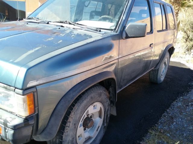 1991 blue/gray Nissan Pathfinder SUV