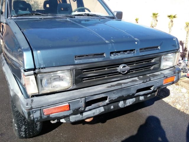 1991 blue/gray Nissan Pathfinder SUV