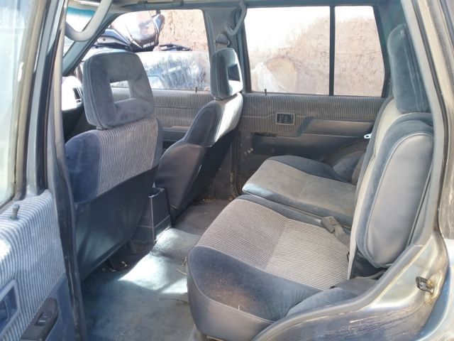 1991 blue/gray Nissan Pathfinder SUV